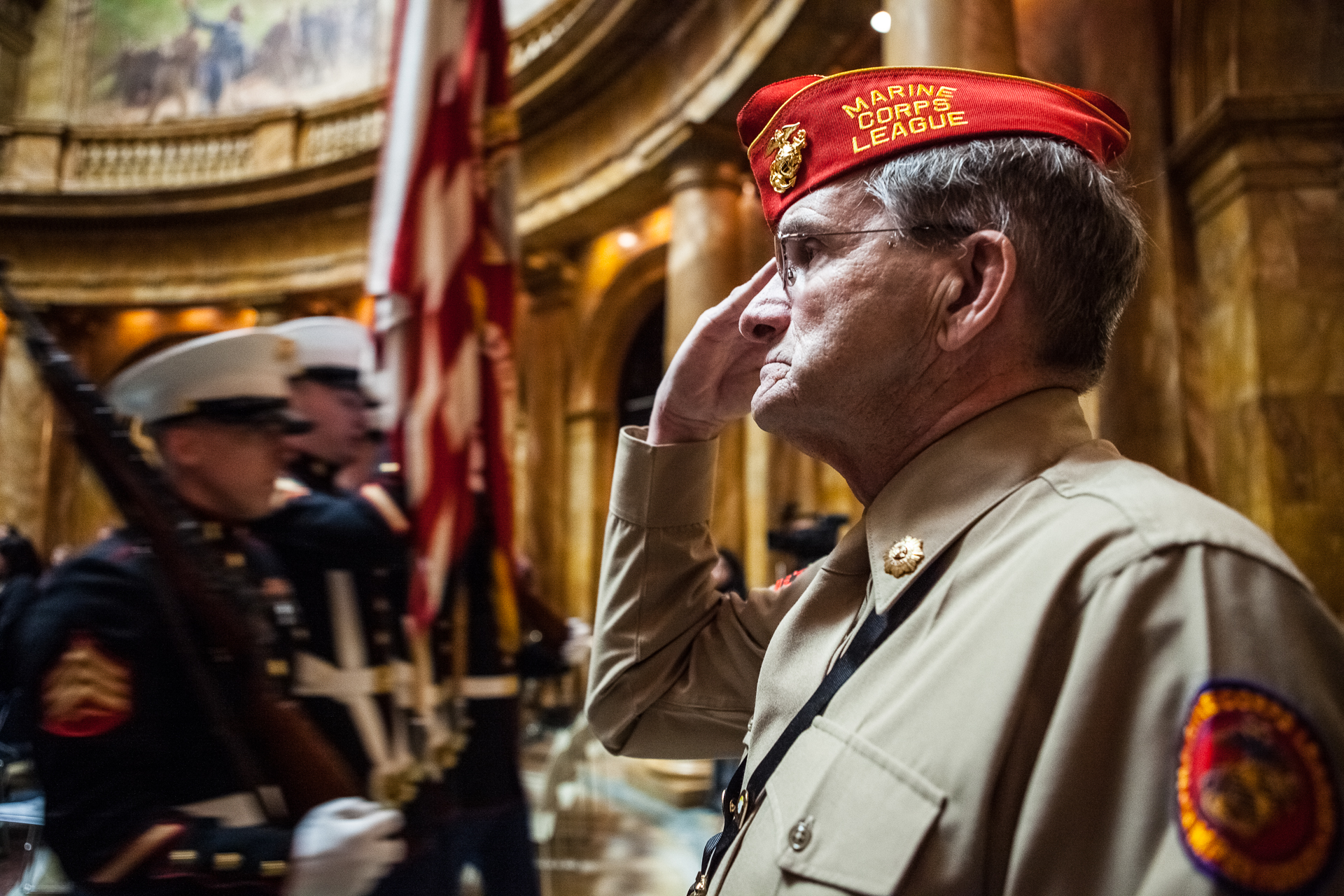 Jim Dolliver, 67, of Holliston, Mass., a member of Marine Corps League Detachment 1037, salutes the colors during the Iwo Jima Day ceremony at the Massachusetts State House in Boston, Feb. 19, 2009. (© 2009 Eric Dietrich Photography)