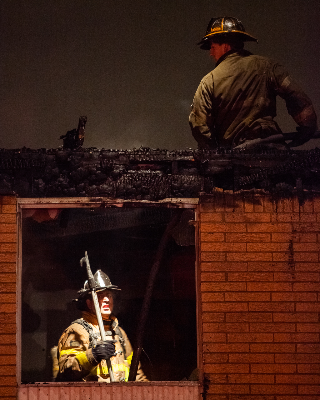 Detroit firefighters work to extinguish a two-alarm fire in an apartment building in Detroit, Nov. 1, 2009. (© 2009 Eric Dietrich Photography)
