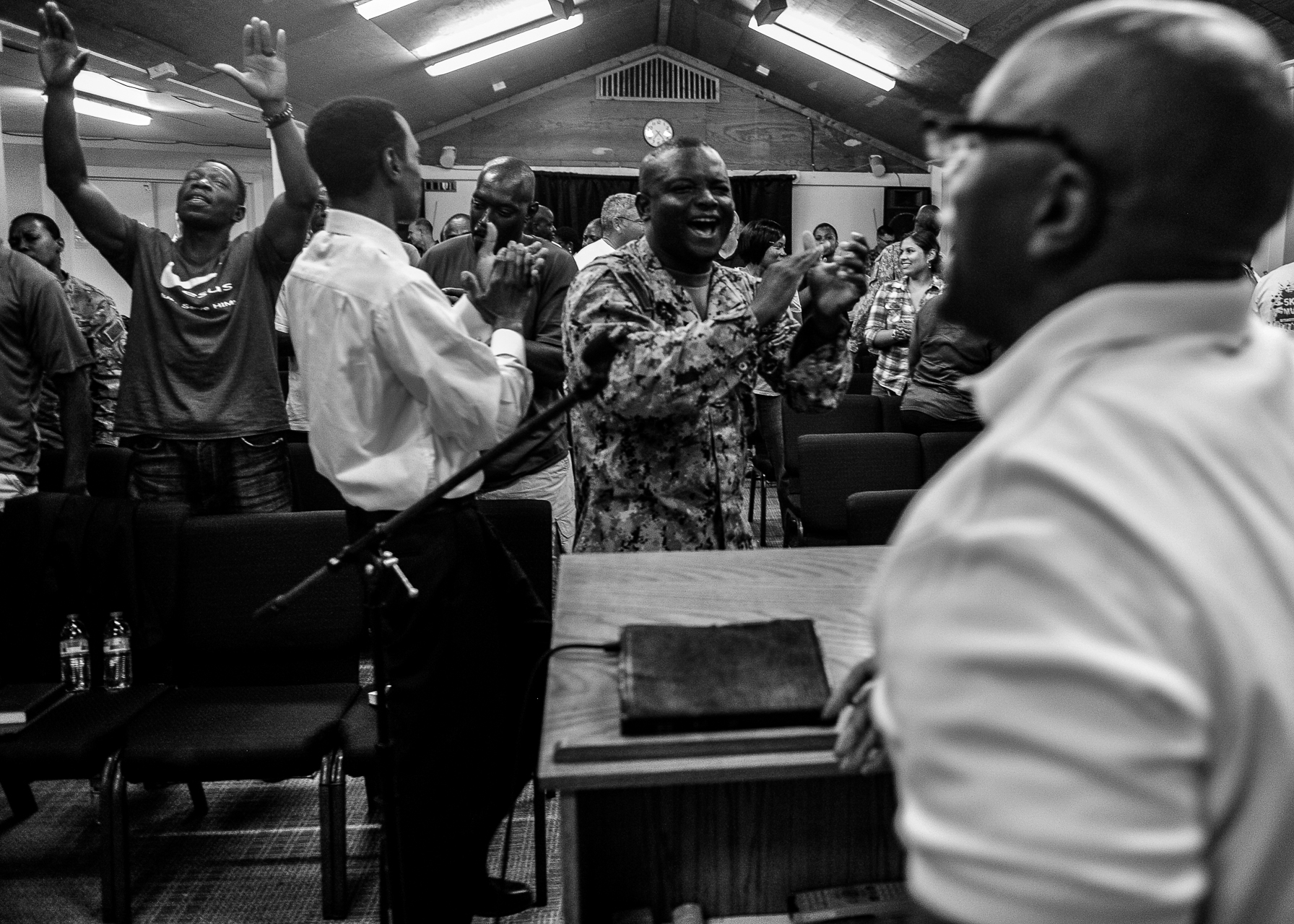Congregants dance during religious services at the chapel on Camp Lemonnier, Djibouti, Sept. 28, 2013. The service was part of the Camp Lemonnier Revival, featuring eight days of Christian worship. (Eric Dietrich/U.S. Navy)