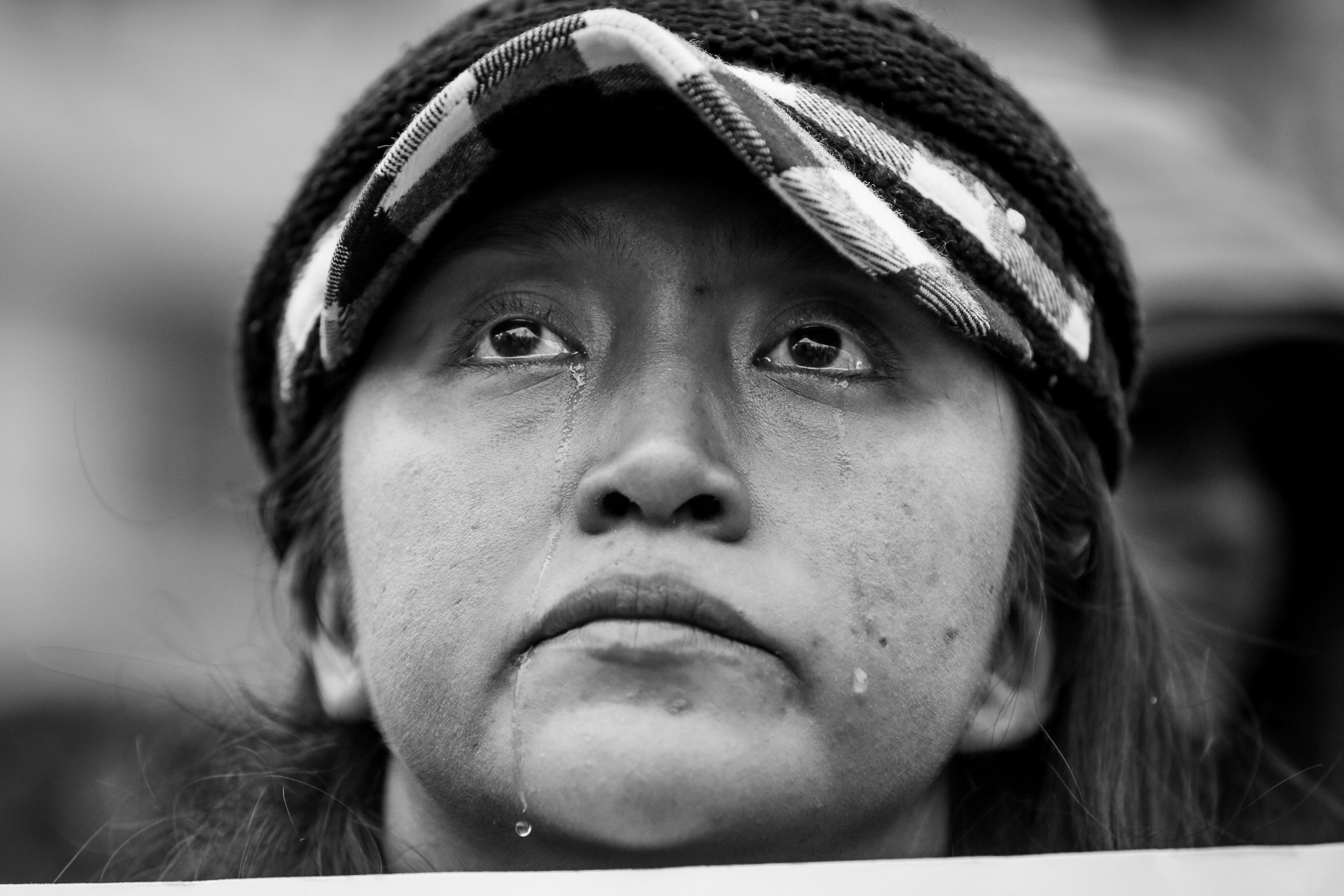 Katty Aoun, 26, of Miami, a member of Democracy Spring Florida, cries while listening to a speaker at an anti-Trump rally at the U.S. Navy Memorial in Washington, D.C., on inauguration day, Jan. 20, 2017. ANSWER Coalition (Act Now to Stop War and End Racism) sponsored the rally in protest of the inauguration of Donald Trump as the 45th president of the United States. (© 2017 Eric Dietrich Photography)