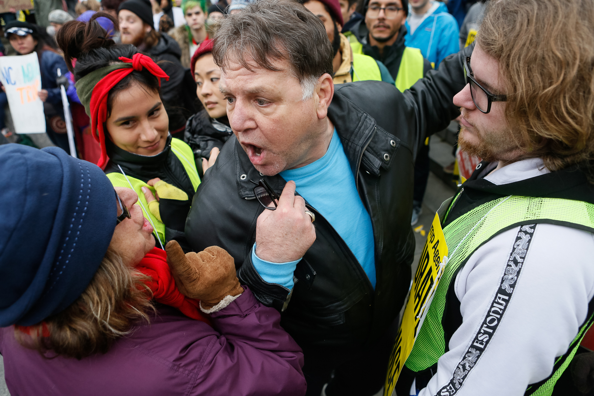 A Trump-supporter, center, confronts protestors at an anti-Trump rally at the U.S. Navy Memorial in Washington, D.C., on inauguration day, Jan. 20, 2017. ANSWER Coalition (Act Now to Stop War and End Racism) sponsored the rally in protest of the inauguration of Donald Trump as the 45th president of the United States. (© 2017 Eric Dietrich Photography)