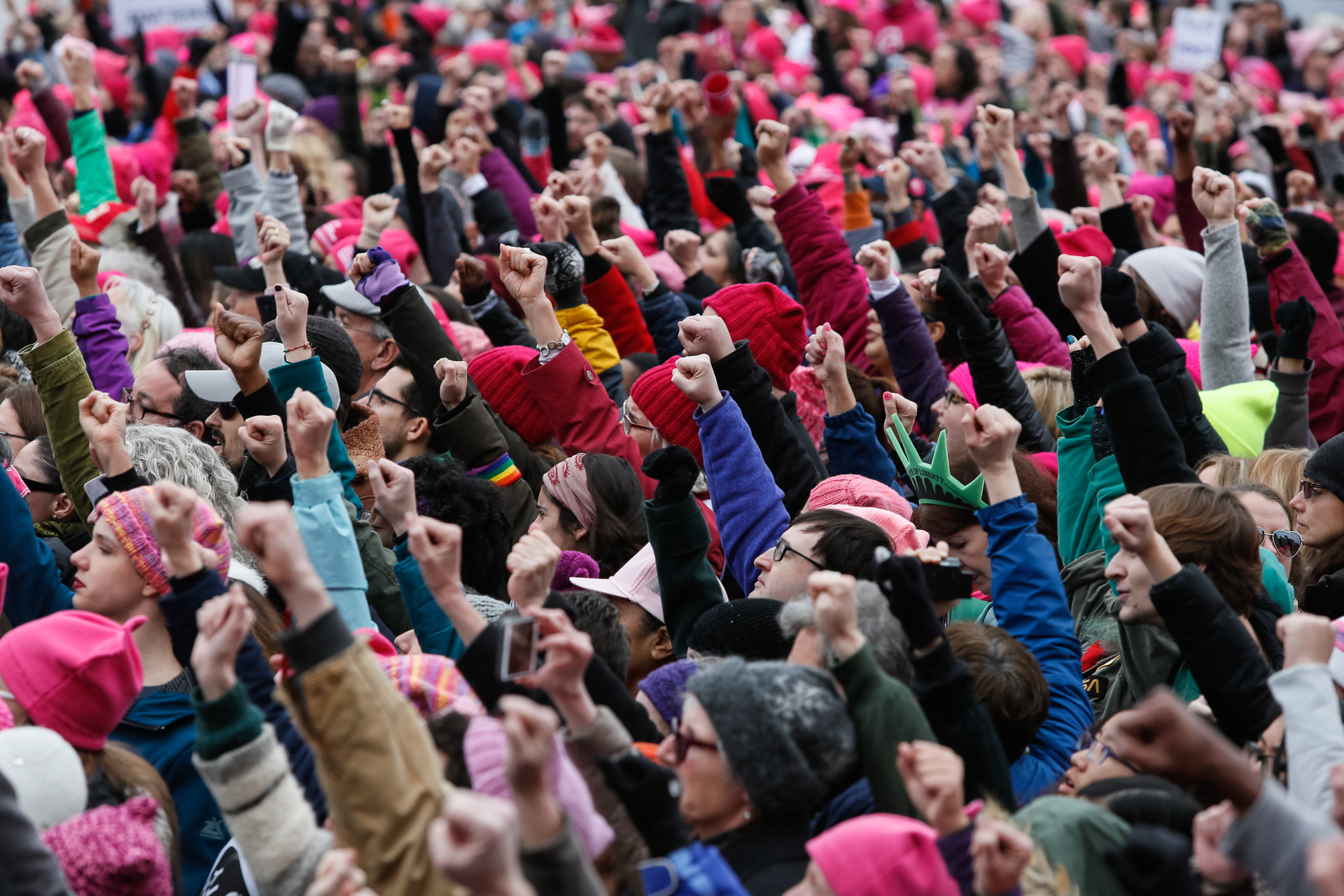 Attendees raise their fists in reaction to a speaker during the Women’s March on Washington, a protest in defense of women’s, minority and human rights, in Washington, D.C., Jan. 21, 2017. An estimated 500,000 people attended the Washington march as well as more than 3 million in sister marches worldwide. (© 2017 Eric Dietrich Photography)