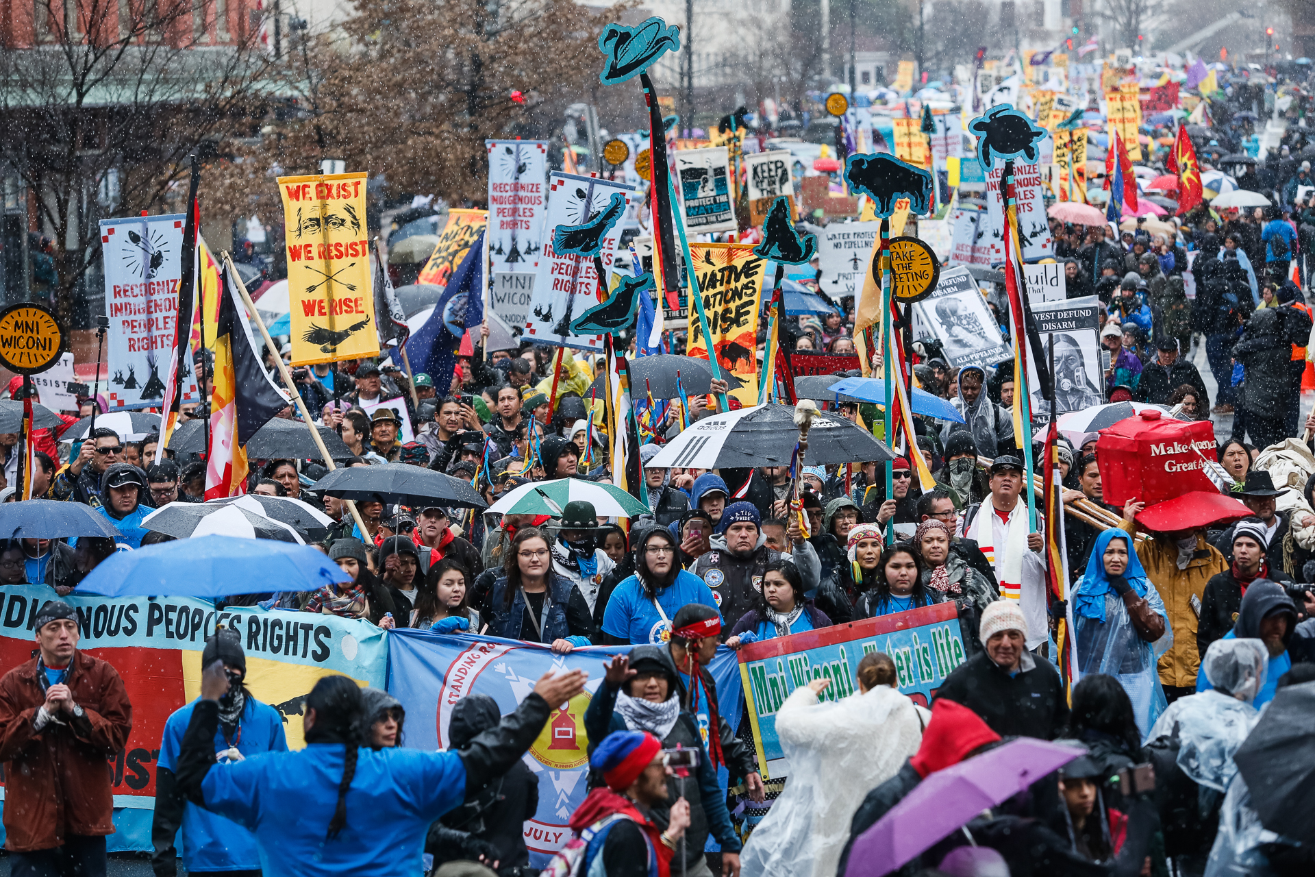 The crowd turns onto 6th Street Northwest during a march in Washington, D.C., on March 10, 2017, to protest the construction of the Dakota Access Pipeline. The march culminated a week of cultural workshops, presentations and a tipi gathering on the grounds of the Washington Monument. (© 2017 Eric Dietrich Photography)