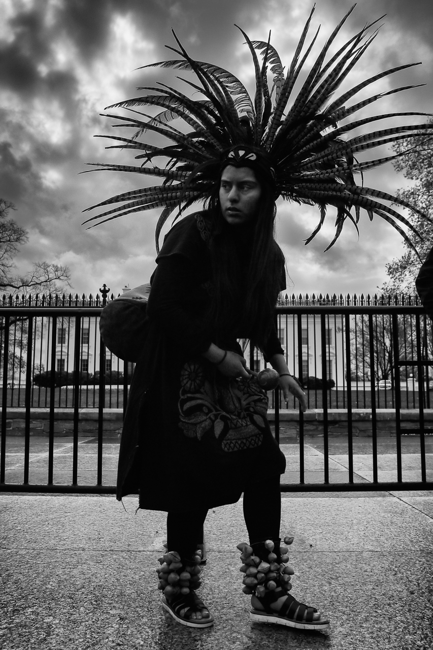 A girl in traditional Native American dress dances in front of the White House during a march in Washington, D.C., on March 10, 2017, to protest the construction of the Dakota Access Pipeline. (© 2017 Eric Dietrich Photography)