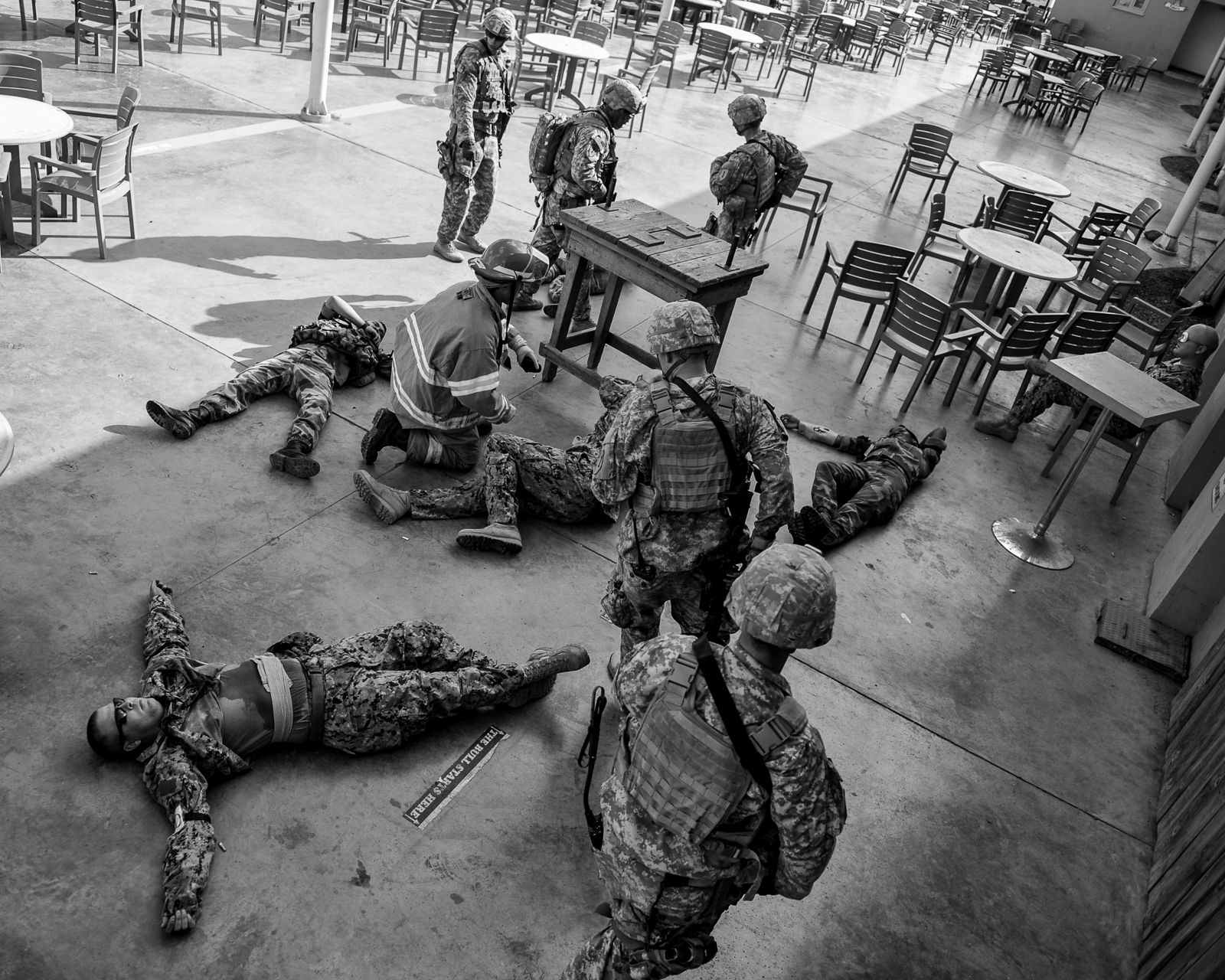 Simulated casualties are brought to a casualty collection point during an active-shooter training exercise on Camp Lemonnier, Djibouti, Nov. 20, 2013. (Eric Dietrich/U.S. Navy)